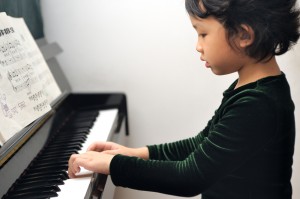 Kid playing piano